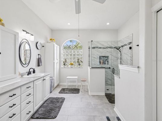 Bathroom, Dual Sink Vanities, Glass Shower, Interior, Marble Walls, Recessed Lighting