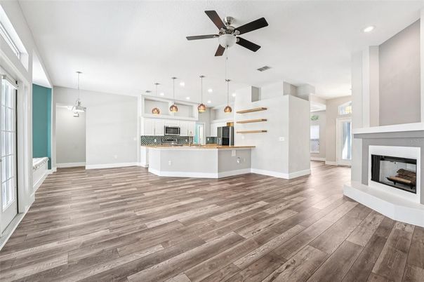 Empty room, Fireplace, Interior, Kitchen, Pendant Lights, Recessed Lighting, Wood Texture Flooring