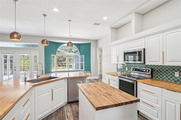 Interior, Kitchen, Pendant Lights, Recessed Lighting, Stainless Steel Appliances, Wood Texture Flooring