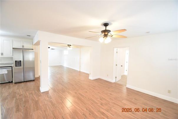 Empty room, Interior, Kitchen, Stainless Steel Appliances, Wood Texture Flooring
