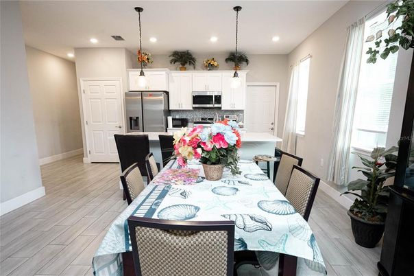 Dining room, Interior, Kitchen, Pendant Lights, Recessed Lighting, Stainless Steel Appliances, Wood Texture Flooring