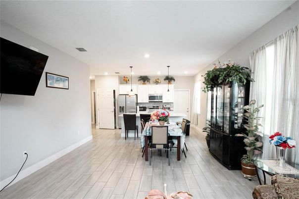 Dining room, Interior, Kitchen, Pendant Lights, Recessed Lighting, Stainless Steel Appliances, Wood Texture Flooring