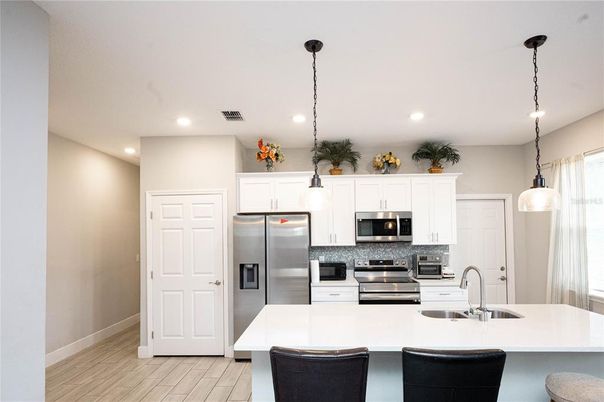 Interior, Kitchen, Pendant Lights, Recessed Lighting, Stainless Steel Appliances, Wood Texture Flooring