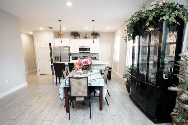 Dining room, Interior, Kitchen, Pendant Lights, Recessed Lighting, Stainless Steel Appliances, Wood Texture Flooring
