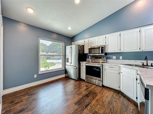 Interior, Kitchen, Recessed Lighting, Stainless Steel Appliances, Wood Texture Flooring