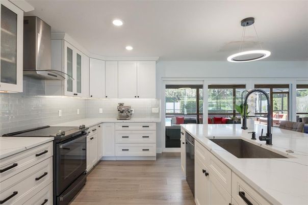 Interior, Kitchen, Pendant Lights, Recessed Lighting, Stainless Steel Appliances, Wood Texture Flooring