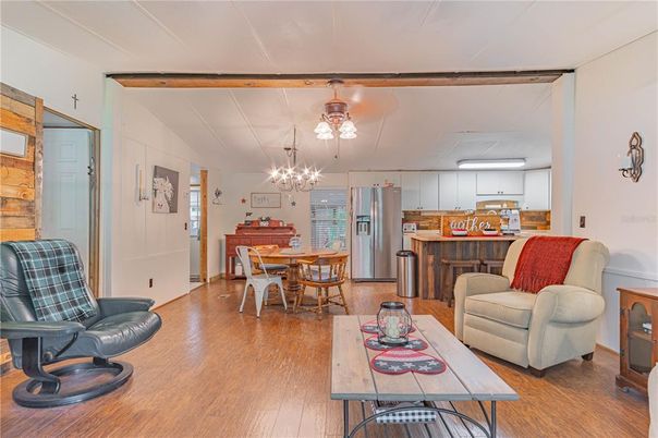 Chandelier, Dining room, Interior, Kitchen, Living room, Pendant Lights, Stainless Steel Appliances, Wood Texture Flooring