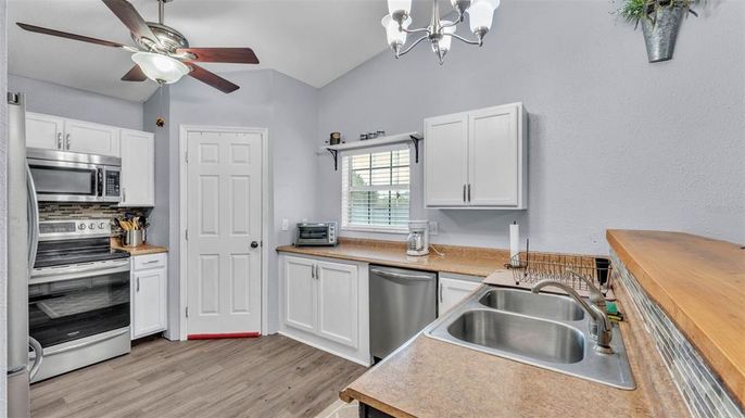 Chandelier, Interior, Kitchen, Stainless Steel Appliances, Wood Texture Flooring