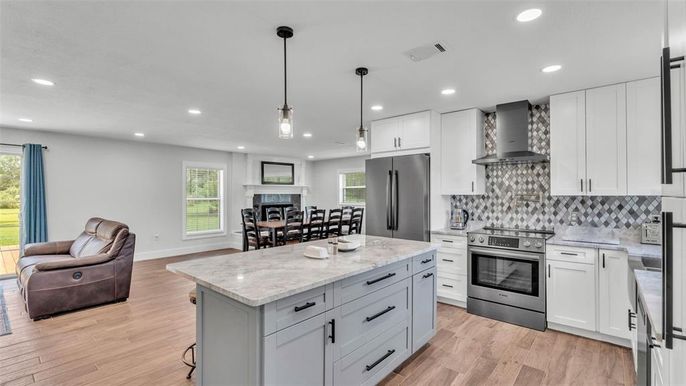 Dining room, Interior, Kitchen, Pendant Lights, Recessed Lighting, Stainless Steel Appliances, Wood Texture Flooring