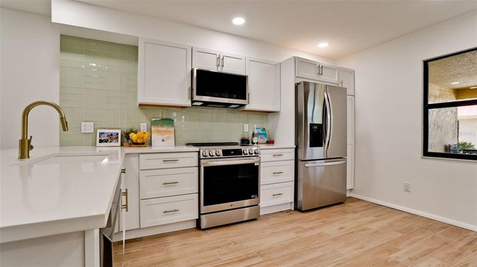 Interior, Kitchen, Recessed Lighting, Stainless Steel Appliances, Wood Texture Flooring