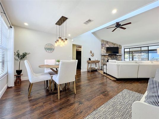 Dining room, Fireplace, Interior, Living room, Pendant Lights, Recessed Lighting, Stone Walls, Wood Texture Flooring