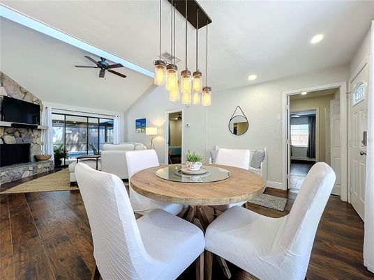 Dining room, Fireplace, Interior, Living room, Pendant Lights, Recessed Lighting, Wood Texture Flooring
