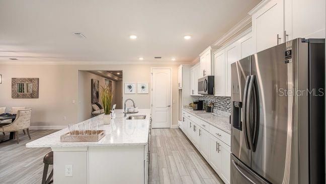 Dining room, Interior, Kitchen, Recessed Lighting, Stainless Steel Appliances, Wood Texture Flooring