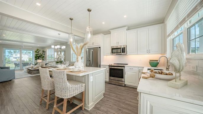 Chandelier, Dining room, Interior, Kitchen, Living room, Pendant Lights, Recessed Lighting, Stainless Steel Appliances, Wood Texture Flooring