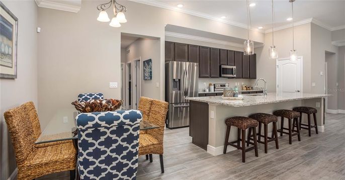 Dining room, Interior, Kitchen, Pendant Lights, Recessed Lighting, Stainless Steel Appliances, Wood Texture Flooring