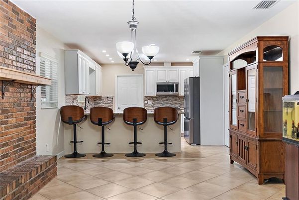 Interior, Kitchen, Pendant Lights, Recessed Lighting, Stainless Steel Appliances, Stone Walls
