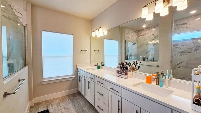 Bathroom, Dual Sink Vanities, Interior, Marble Walls, Wood Texture Flooring
