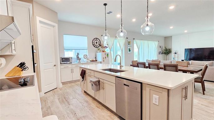 Dining room, Interior, Kitchen, Pendant Lights, Recessed Lighting, Stainless Steel Appliances, Wood Texture Flooring