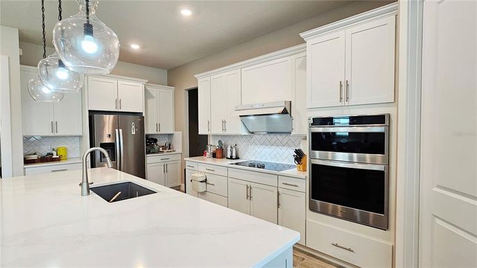 Interior, Kitchen, Pendant Lights, Recessed Lighting, Stainless Steel Appliances, Wood Texture Flooring