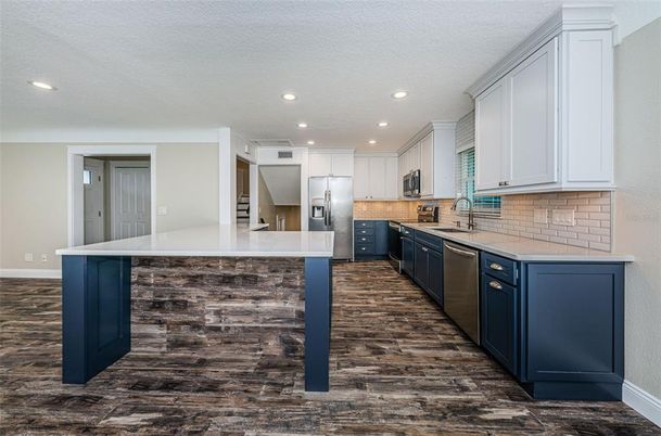 Interior, Kitchen, Recessed Lighting, Stainless Steel Appliances, Wood Texture Flooring