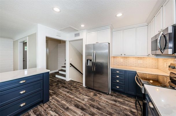 Interior, Kitchen, Recessed Lighting, Stainless Steel Appliances, Wood Texture Flooring