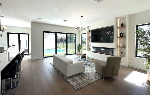 Dining room, Fireplace, Interior, Living room, Pendant Lights, Recessed Lighting, Wood Texture Flooring