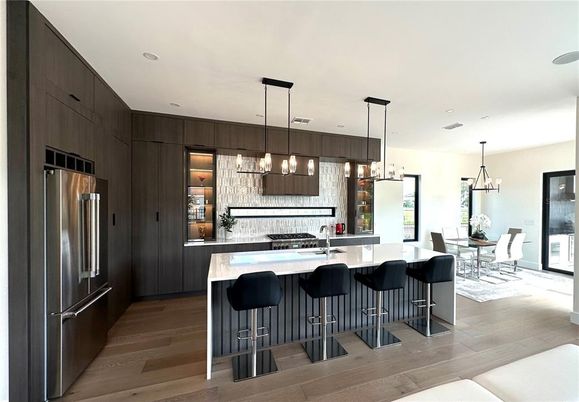 Dining room, Interior, Kitchen, Pendant Lights, Recessed Lighting, Stainless Steel Appliances, Wood Texture Flooring
