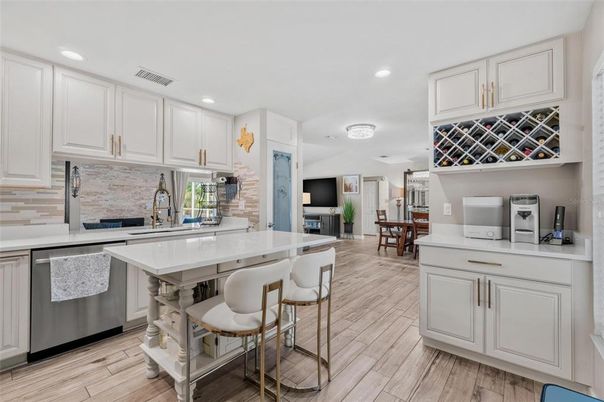 Dining room, Interior, Kitchen, Recessed Lighting, Stainless Steel Appliances, Wood Texture Flooring
