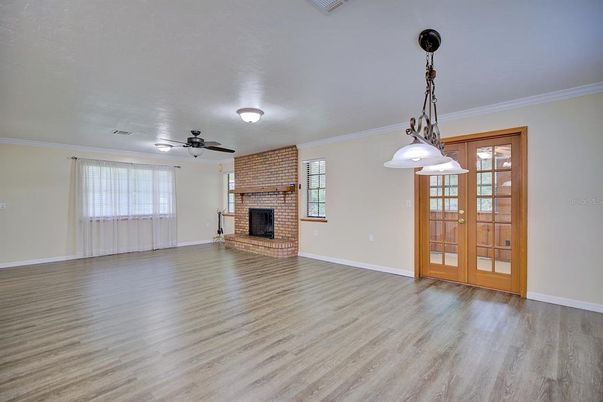 Empty room, Fireplace, Interior, Pendant Lights, Stone Walls, Wood Texture Flooring