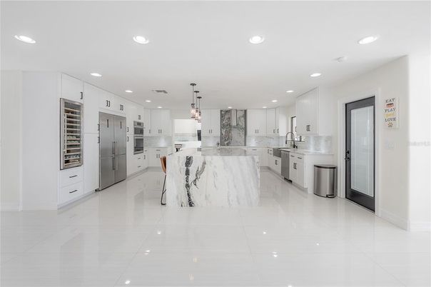 Interior, Kitchen, Marble Walls, Pendant Lights, Recessed Lighting, Stainless Steel Appliances