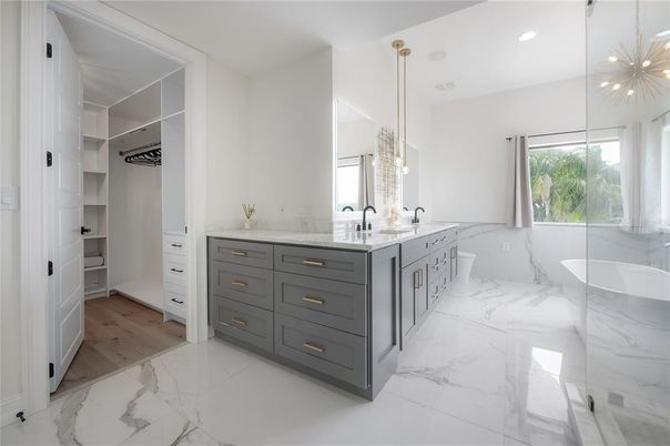 Bathroom, Dual Sink Vanities, Interior, Marble, Pendant Lights, Recessed Lighting, Walk-in Closets