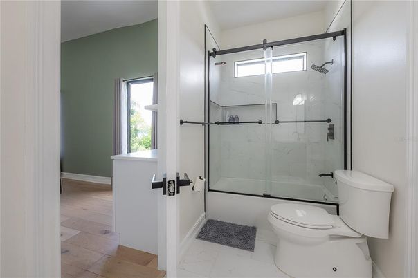 Bathroom, Glass Shower, Interior, Marble Walls, Wood Texture Flooring