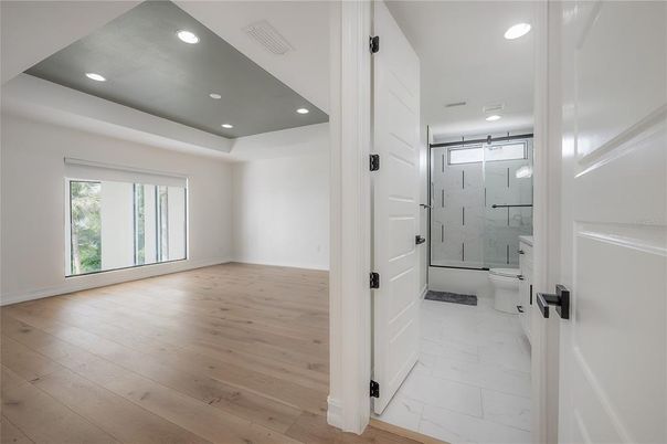 Bathroom, Glass Shower, Interior, Marble, Marble Walls, Recessed Lighting, Wood Texture Flooring