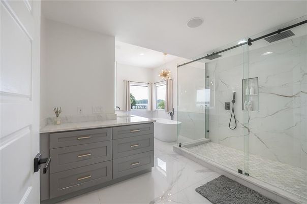 Bathroom, Free Standing Baths, Glass Shower, Interior, Marble, Marble Walls, Pendant Lights, Recessed Lighting
