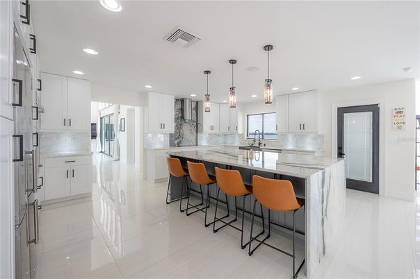 Interior, Kitchen, Marble Walls, Pendant Lights, Recessed Lighting, Stainless Steel Appliances