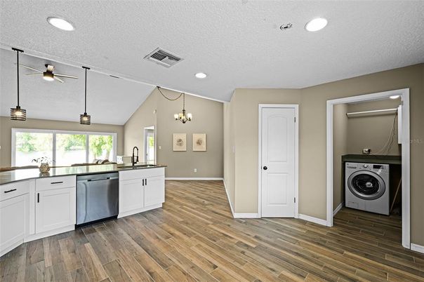 Interior, Kitchen, Recessed Lighting, Washer, Wood Texture Flooring