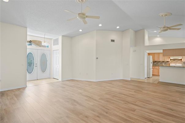 Empty room, Interior, Kitchen, Recessed Lighting, Washer, Wood Texture Flooring