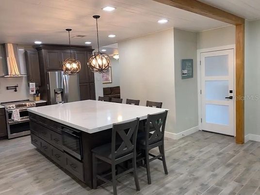 Interior, Kitchen, Pendant Lights, Recessed Lighting, Stainless Steel Appliances, Wood Texture Flooring