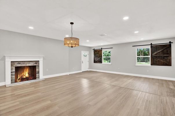 Empty room, Fireplace, Interior, Pendant Lights, Recessed Lighting, Wood Texture Flooring