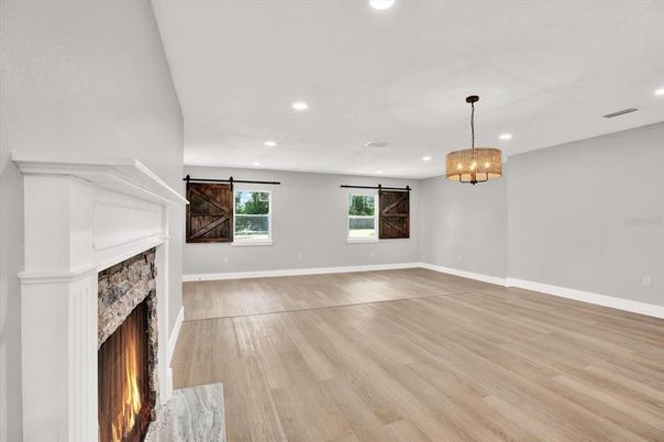 Chandelier, Empty room, Fireplace, Interior, Pendant Lights, Recessed Lighting, Wood Texture Flooring