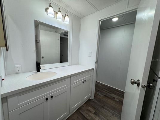 Bathroom, Dual Sink Vanities, Interior, Recessed Lighting, Wood Texture Flooring