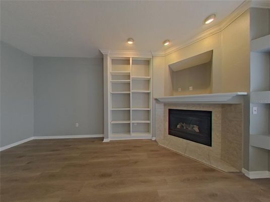 Empty room, Fireplace, Interior, Recessed Lighting, Wood Texture Flooring