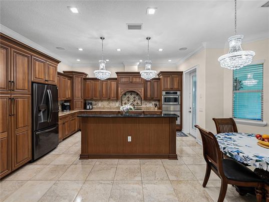 Chandelier, Dining room, Interior, Kitchen, Pendant Lights, Recessed Lighting, Stainless Steel Appliances