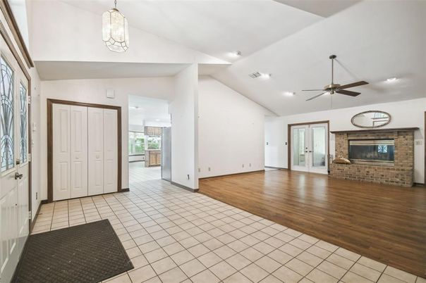 Empty room, Fireplace, Interior, Recessed Lighting, Stone Walls, Wood Texture Flooring