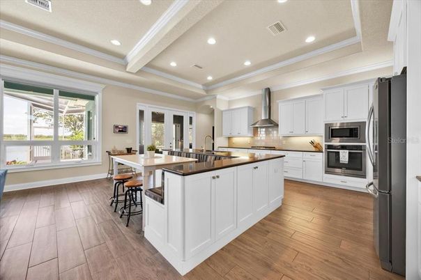 Dining room, Interior, Kitchen, Recessed Lighting, Stainless Steel Appliances, Wood Texture Flooring