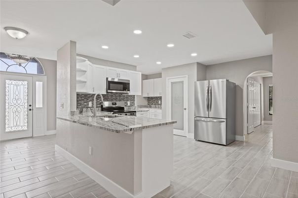 Interior, Kitchen, Recessed Lighting, Stainless Steel Appliances, Wood Texture Flooring