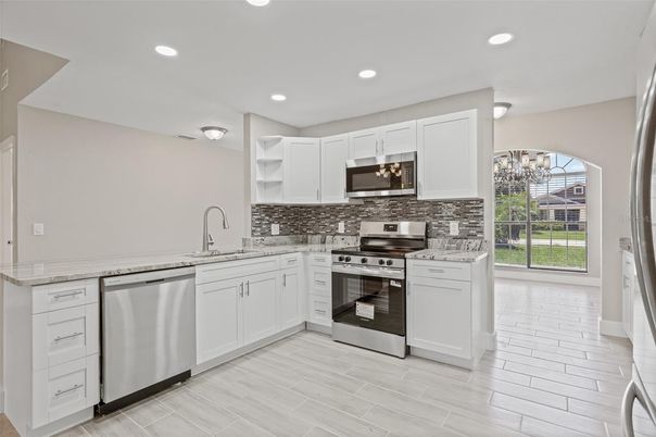 Chandelier, Interior, Kitchen, Recessed Lighting, Stainless Steel Appliances, Wood Texture Flooring