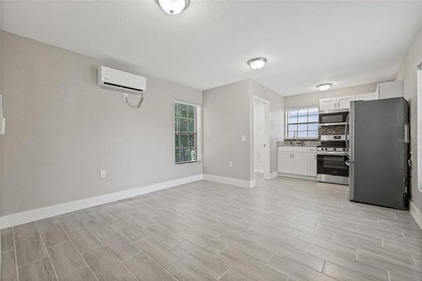 Empty room, Interior, Kitchen, Stainless Steel Appliances, Wood Texture Flooring