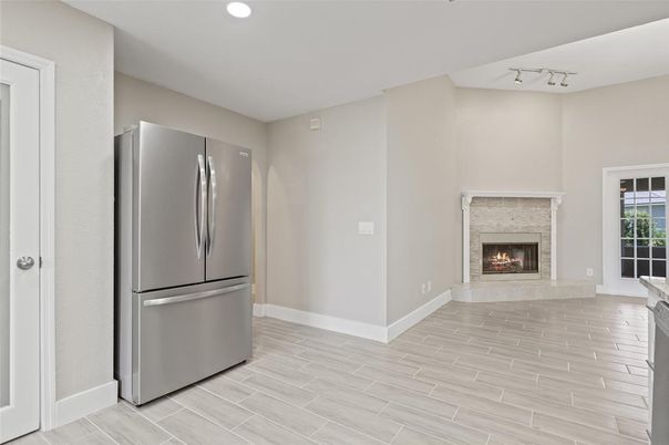 Fireplace, Interior, Kitchen, Recessed Lighting, Stainless Steel Appliances, Wood Texture Flooring
