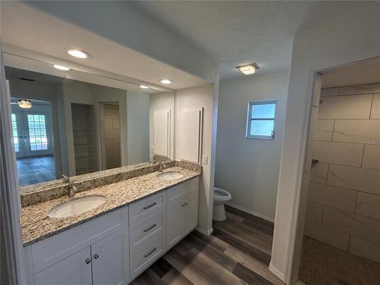 Bathroom, Dual Sink Vanities, Interior, Recessed Lighting, Wood Texture Flooring